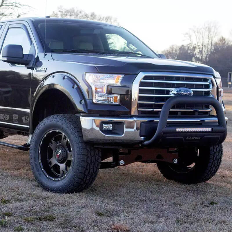 Truck driving on rugged terrain with Lund gear
